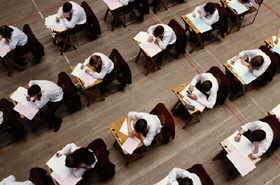 Rows of desks and students.